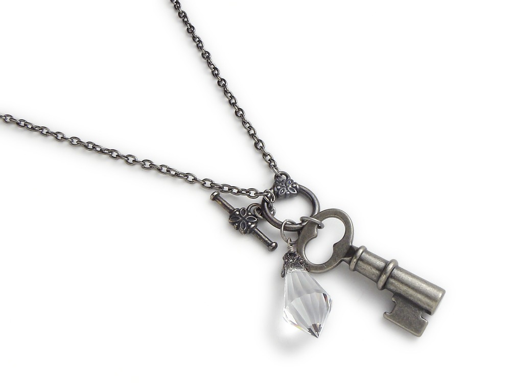 Antiqued silver skeleton key charm necklace faceted crystal briolette toggle clasp filigree design