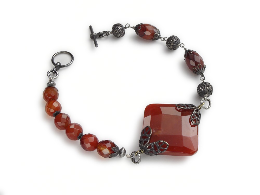 Neo Victorian asymmetrical antiqued silver filigree bracelet faceted genuine Carnelian and Red Agate beads round oval and cushion square cut toggle clasp jewelry design