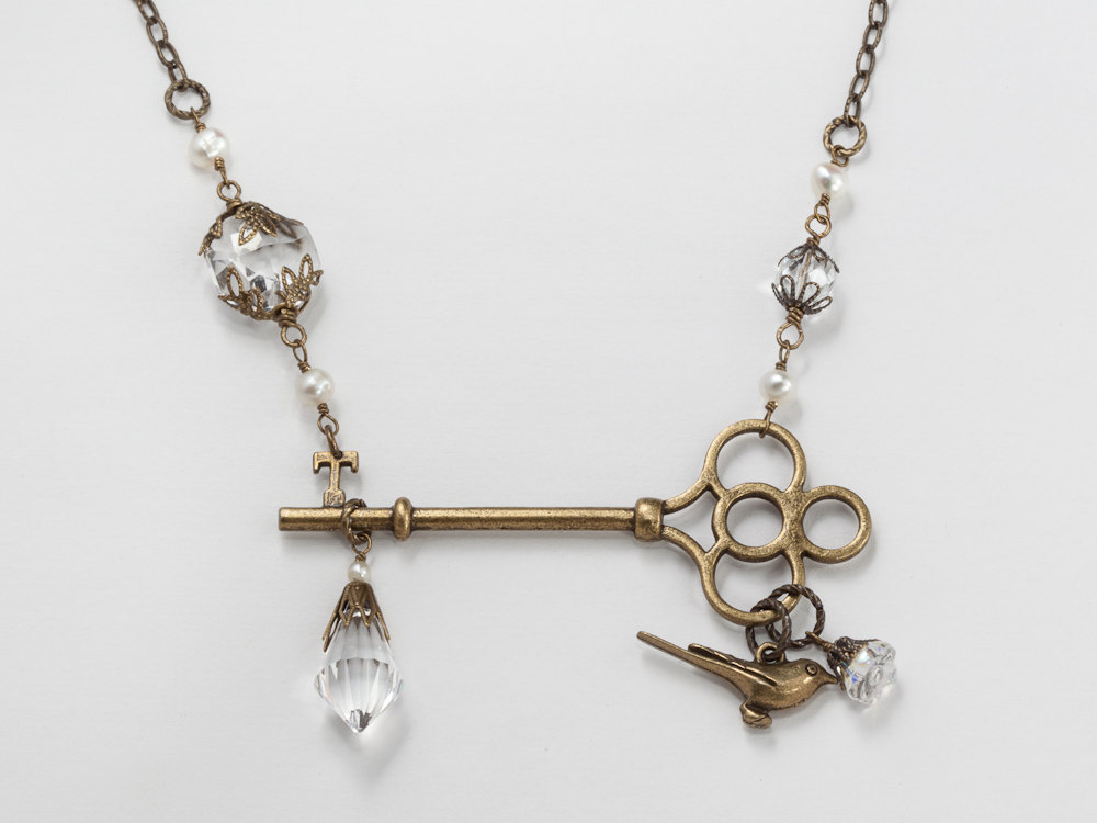Neo Victorian necklace skeleton key crystal pearls bird charm flower leaf gold filigree wedding jewelry