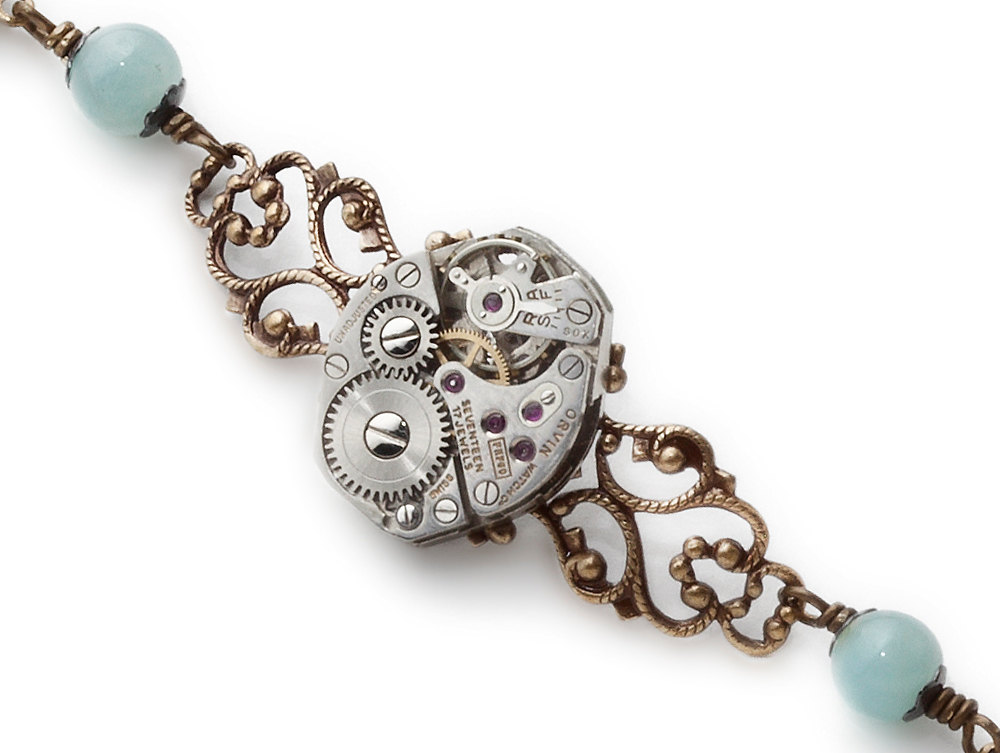 Steampunk bracelet Victorian gold brass filigree antique watch movement gears blue green genuine aquamarine