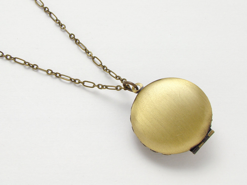Steampunk locket necklace antique watch movement gears blue Swarovski crystal gold brass filigree