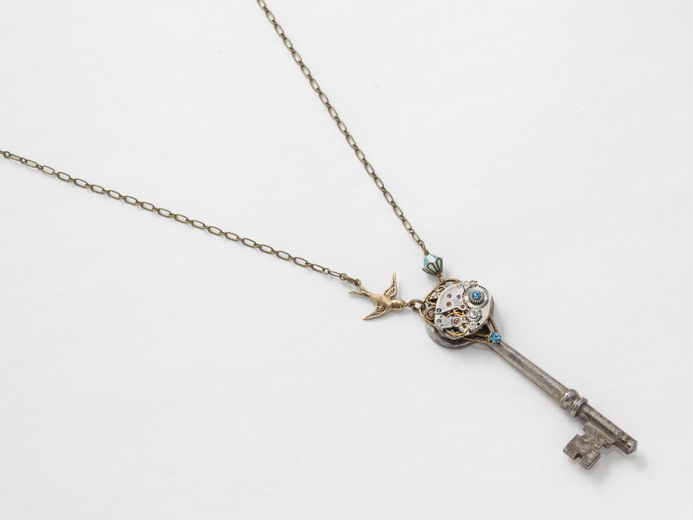 Steampunk Necklace Antique skeleton key with silver watch movement blue opal crystal bird pendant gold filigree Statement necklace