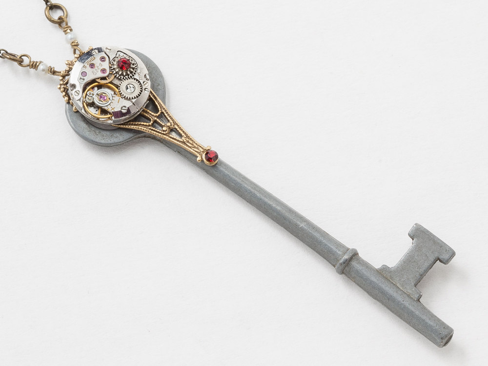 Steampunk Necklace Antique skeleton key with silver watch movement red ruby crystal pearl pendant gold filigree Statement necklace