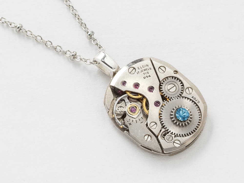 Steampunk Necklace Elgin watch movement pendant with ruby jewels gears and blue swarovski crystal