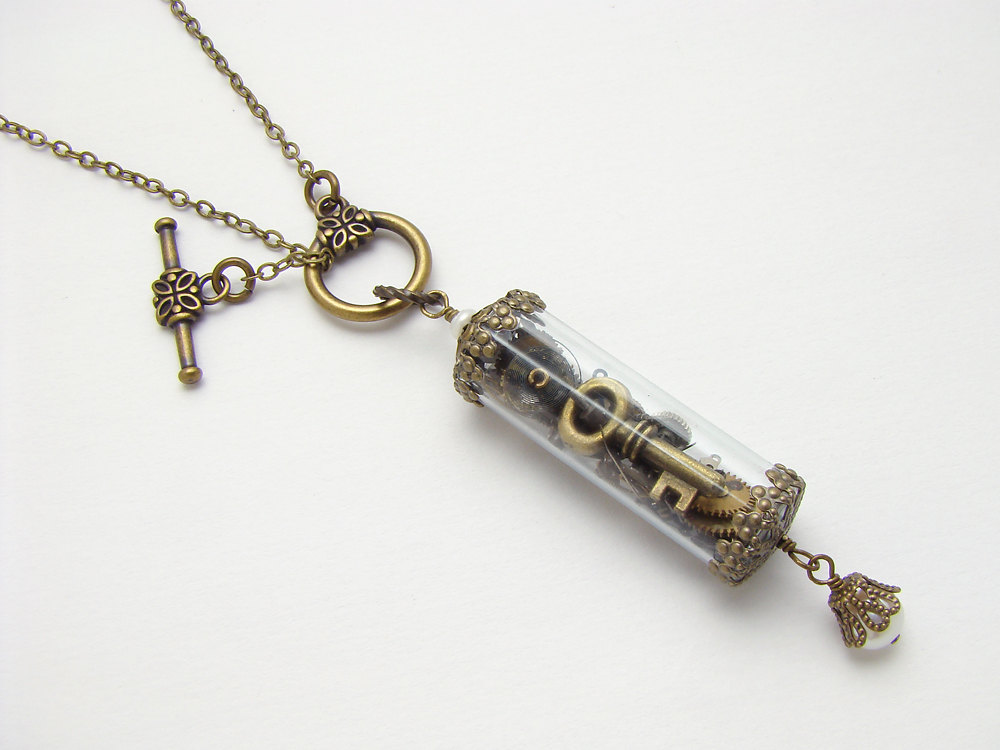 Steampunk Necklace watch parts gears skeleton key charm glass vial bottle pearl gold brass filigree