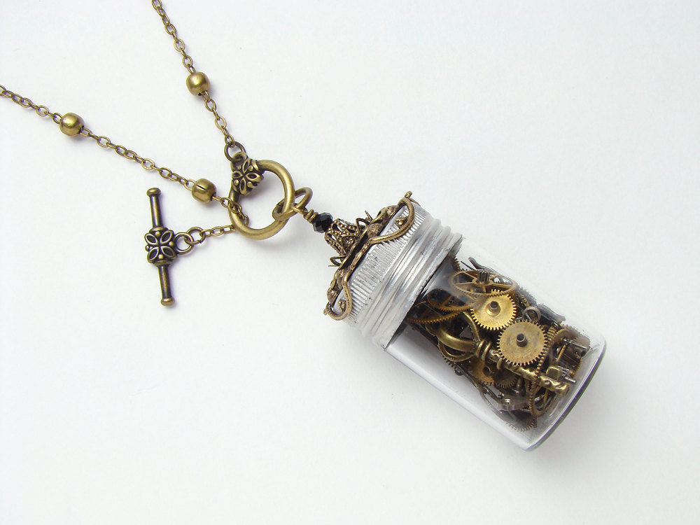 Steampunk Necklace watch parts gears wheels glass vial key charm time in a bottle black crystal gold filigree