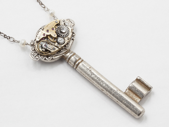 skeleton key watch movement gear silver filigree pearl crystal pendant close up by Maria Sparks