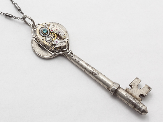 skeleton key watch movement silver filigree blue topaz crystal  close up by Maria Sparks