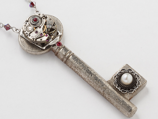 skeleton key watch movement silver filigree garnet red crystal pearl pendant close up by Maria Sparks
